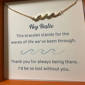 Elegant Gold Bracelet with Blue Waves